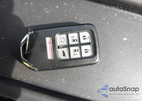 2023 Honda Odyssey Touring z USA, uszkodzony, nr VIN 5FNRL6H80PB004704